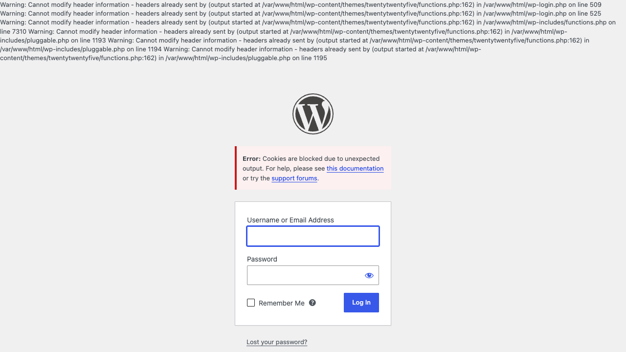 The WordPress login page with Cannot modify header information warnings above the logo and the red error Cookies are blocked due to unexpected output